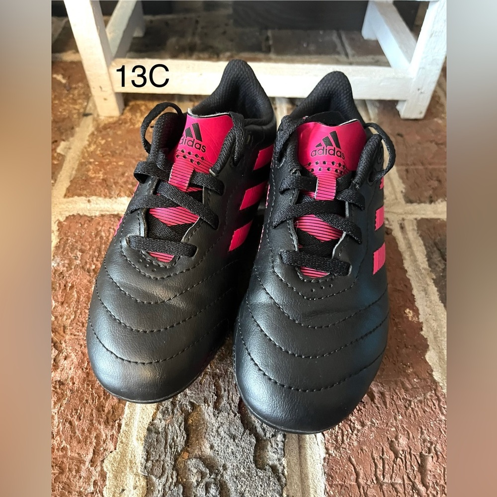 Adidas Kids Black Cleats with Pink Accents